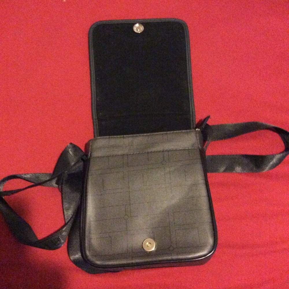 Black adjustable strap Paris bag, multiple pockets
